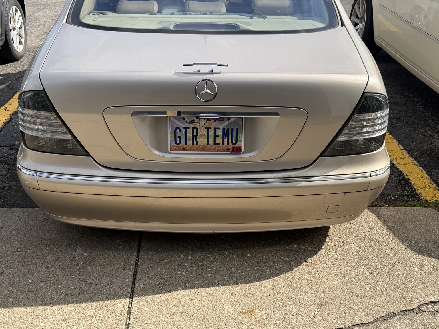 Actual rear view of Allison in a parking lot, showing the small trunk spoiler and GTR TEMU plate.