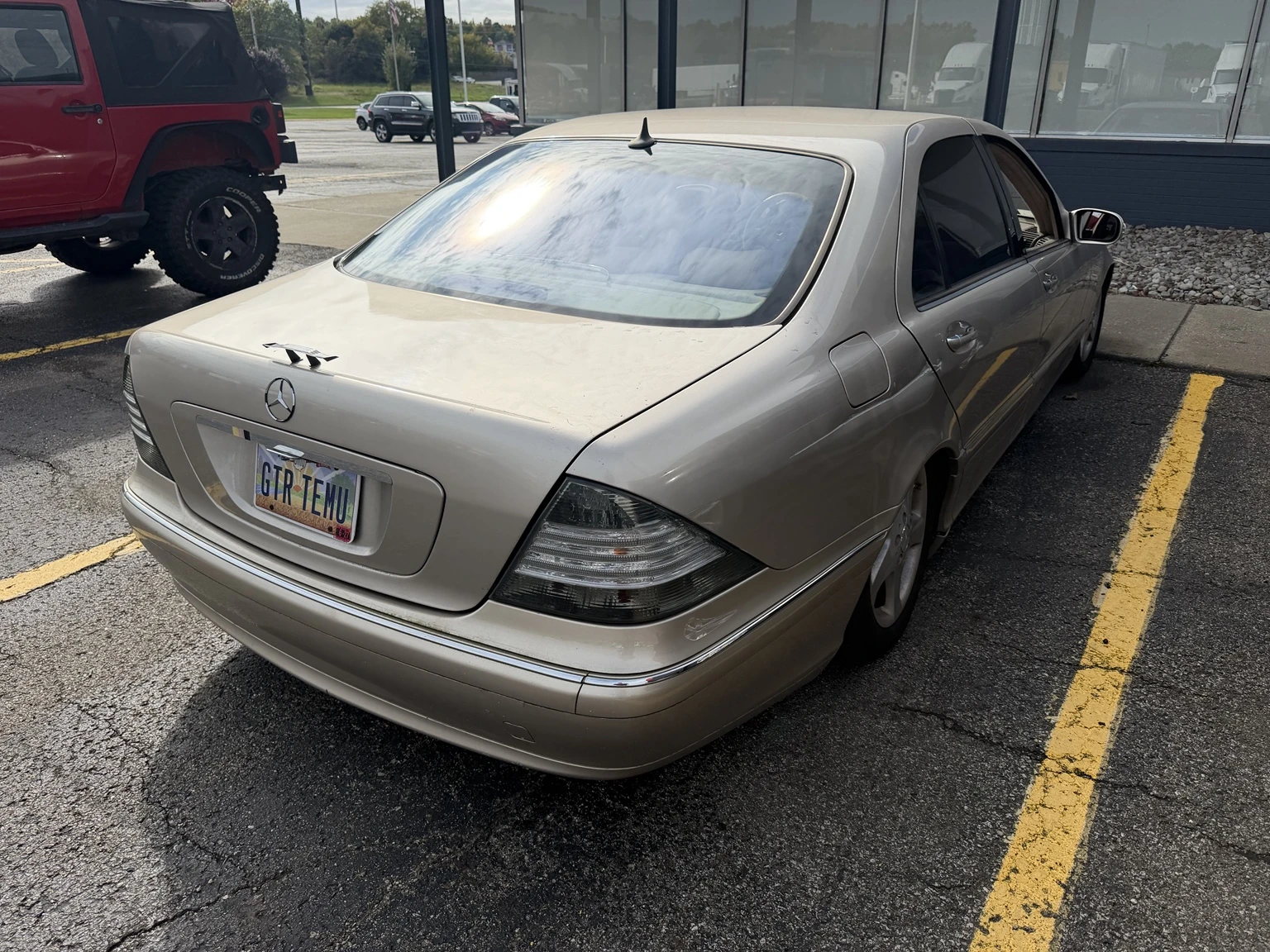 Actual rear three-quarter view of Allison parked between yellow lines.
