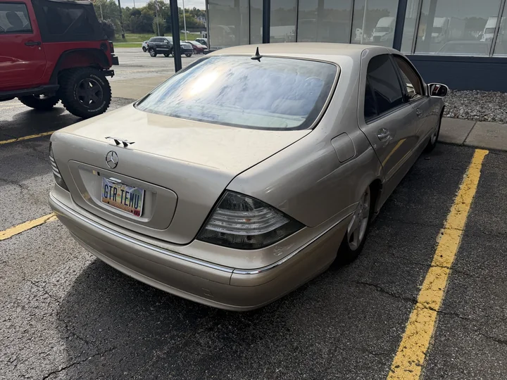 Actual rear three-quarter view of Allison parked between yellow lines.