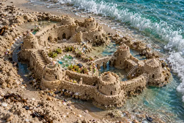 Crescent Sandcastle beside Teal Surf.